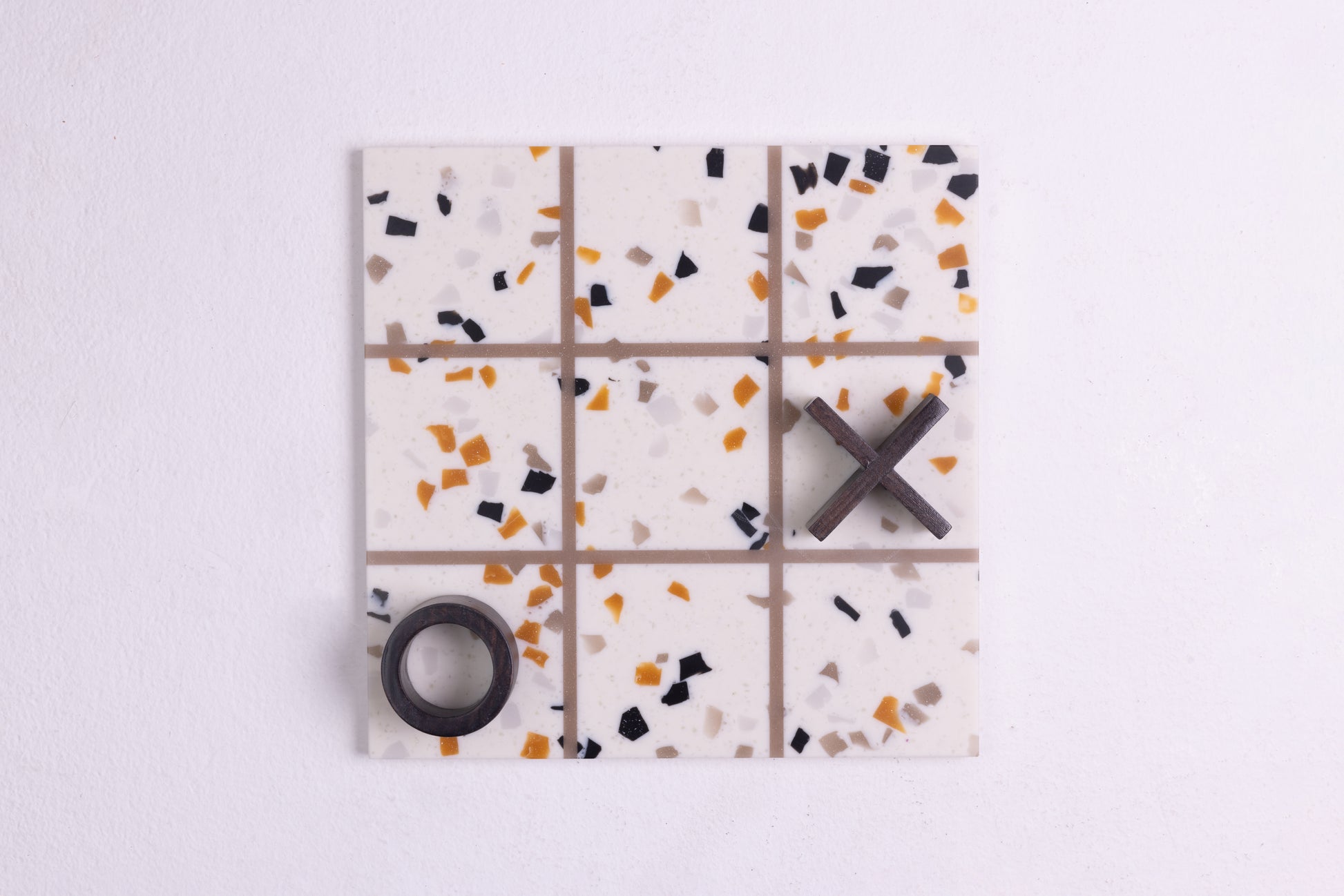 x and o Board game decorative accent made from terrazzo and wood